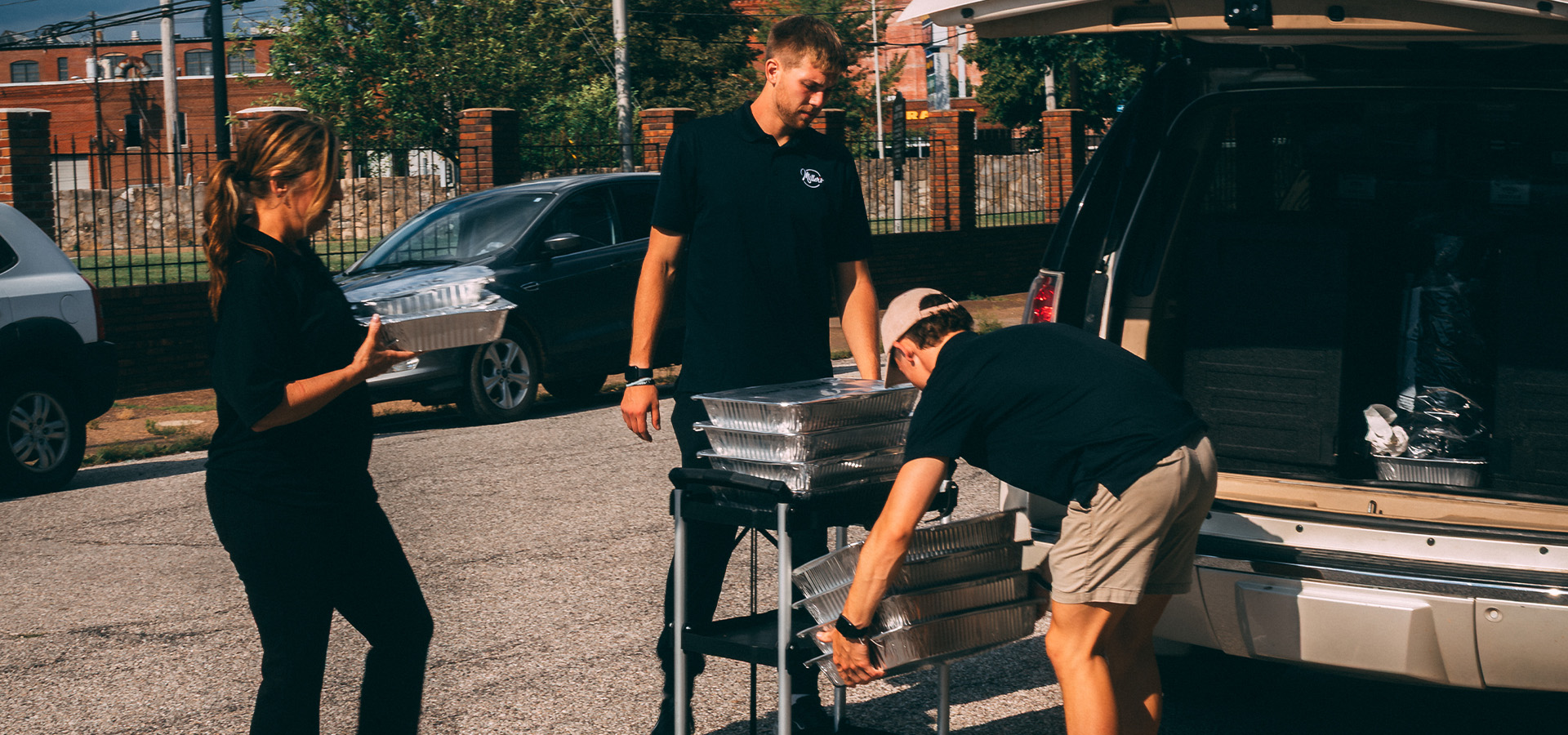 Miller's Barbecue catering team serving an event buffet